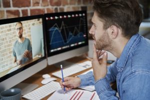 Adult man is taking an online management course